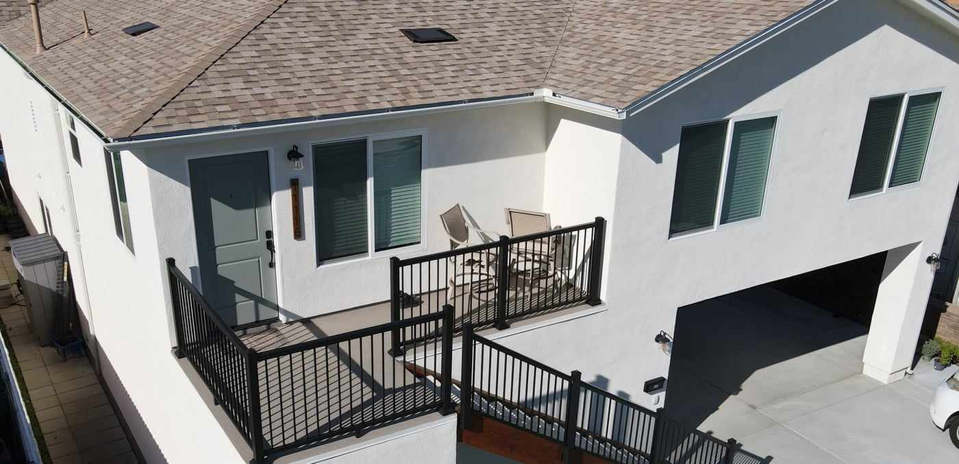Aerial view of the attached ADU entry deck and staircase above a Mira Mesa garage