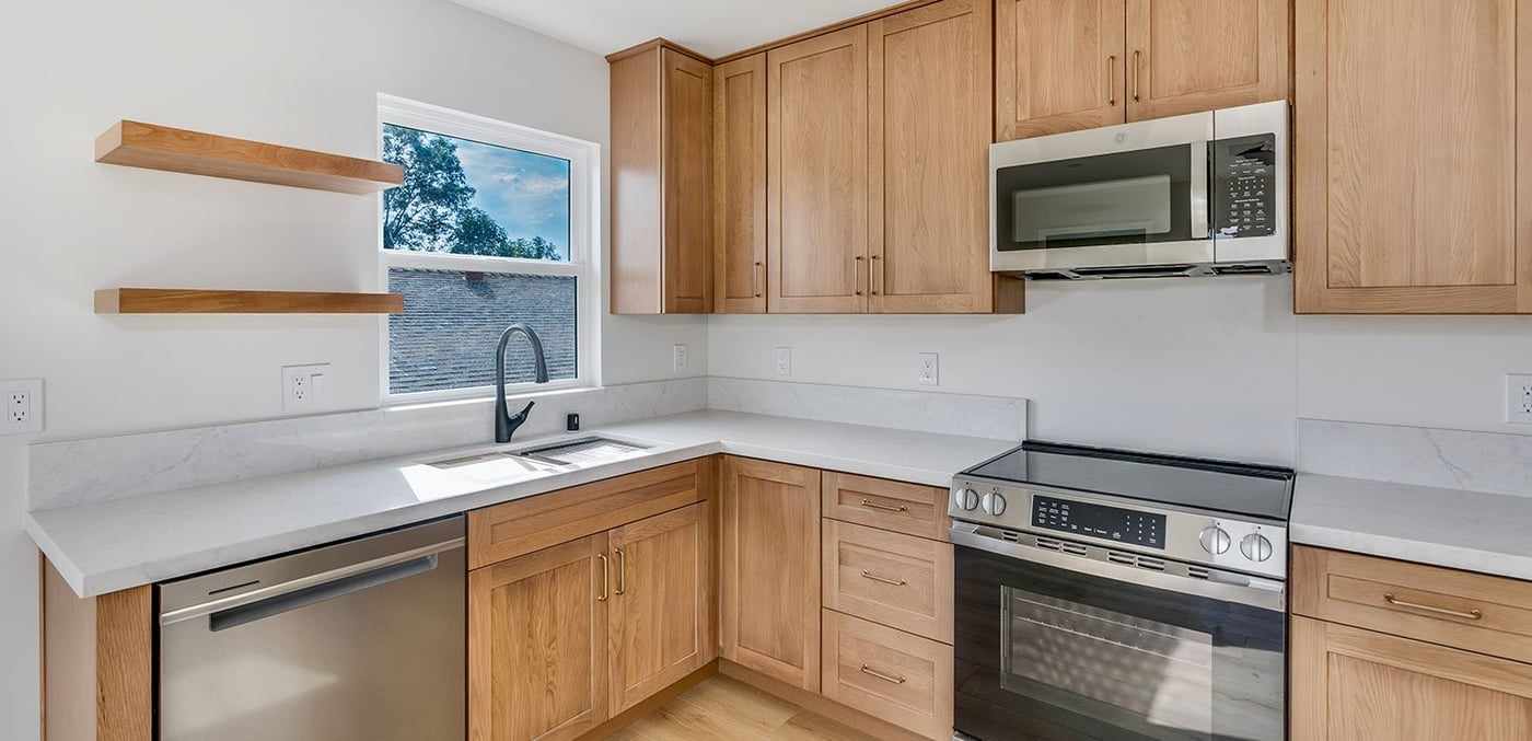 ADU kitchen corner with a range, microwave and dishwasher