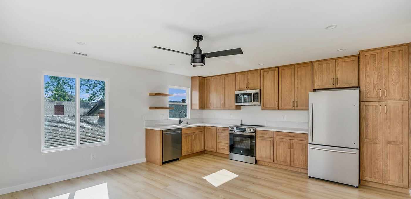 ADU kitchen and living area with a ceiling fan