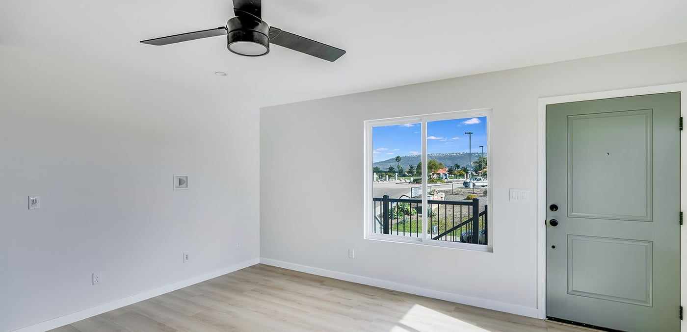 ADU living room with the front door and a window