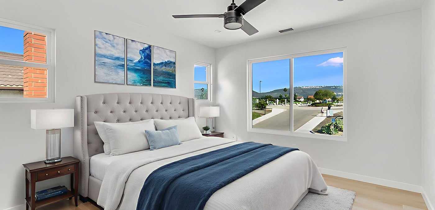 Furnished ADU bedroom with a window and a ceiling fan