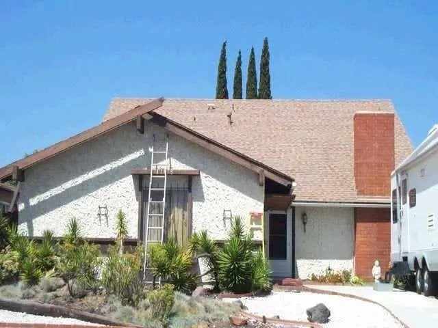 Front of the Mira Mesa home before the attached ADU was built over the garage