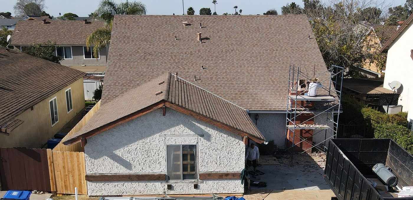 Aerial view of the Mira Mesa home before the attached ADU was built, with scaffolding at the garage