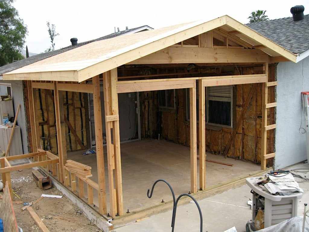 Framing for a room addition on a San Diego home, with the roof trusses and wall studs in place