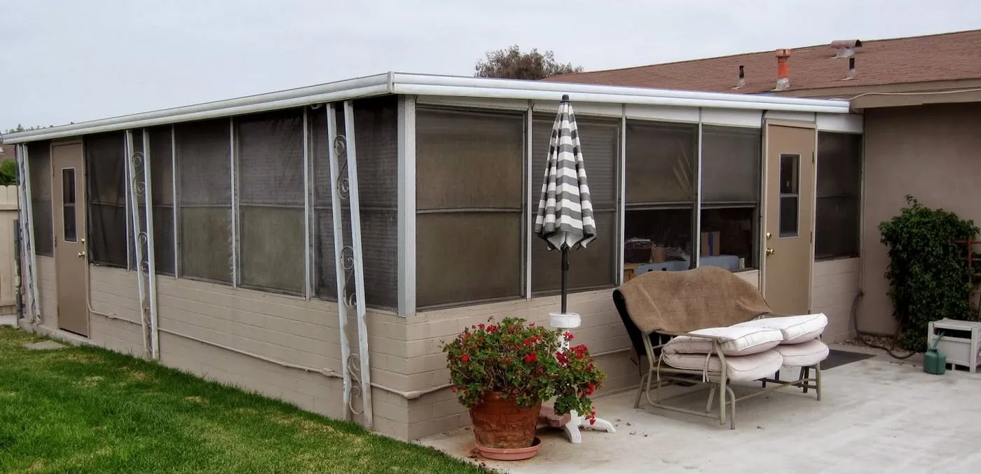 Screened sunroom on the back of a house