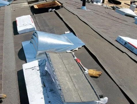 New roof vents going in over underlayment during a shingle reroof