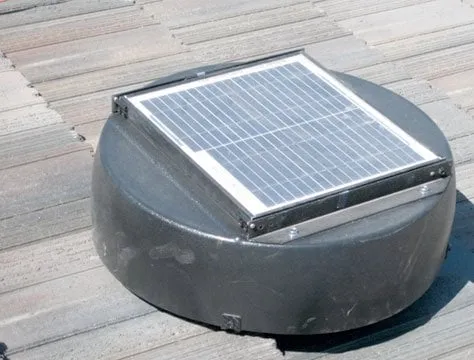 Solar-powered attic fan on a tile roof