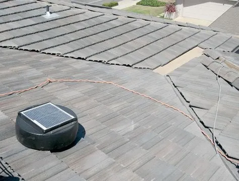 Solar attic fan installed on a concrete tile roof